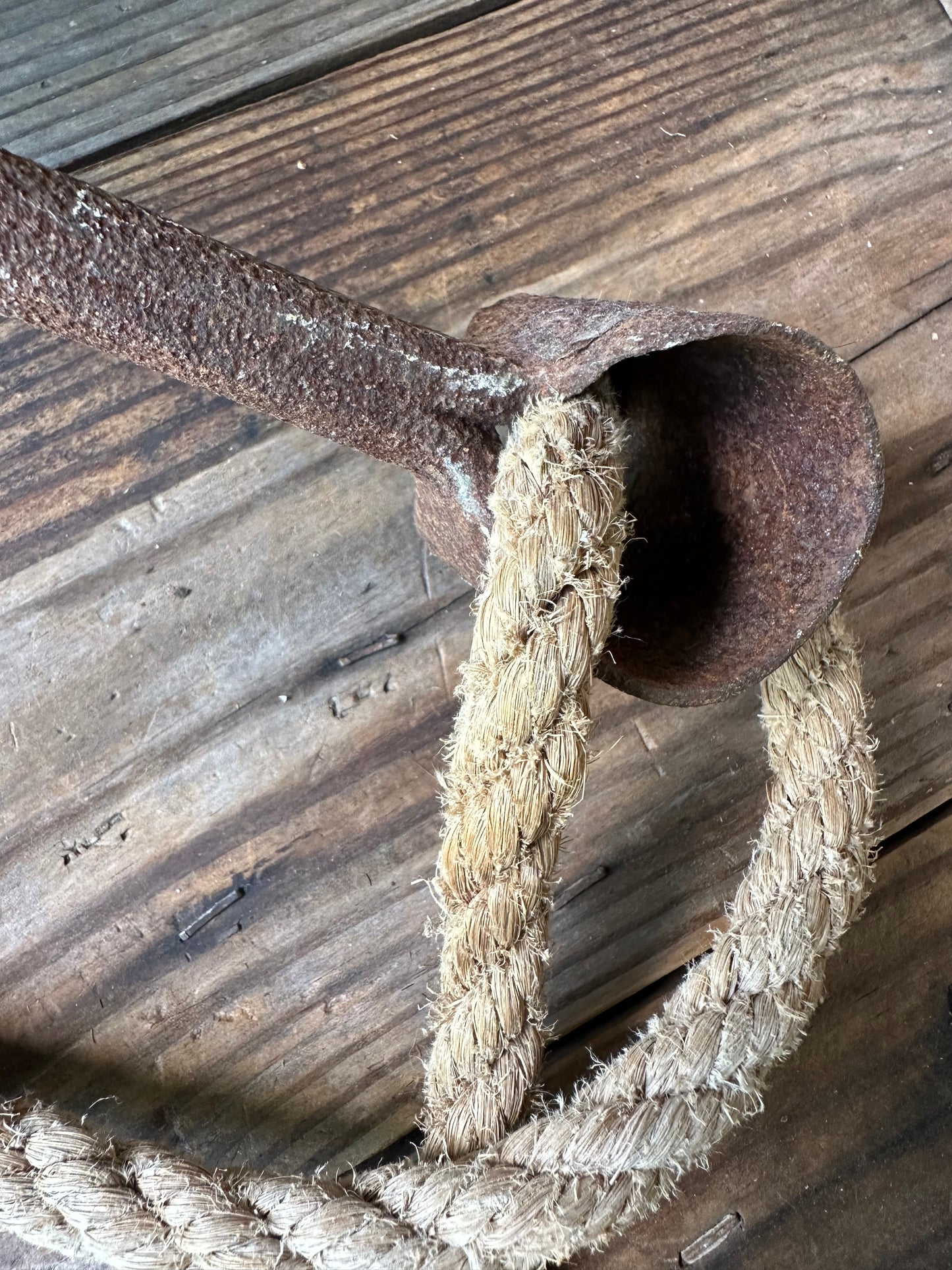 Rusty Metal Hook With Rope