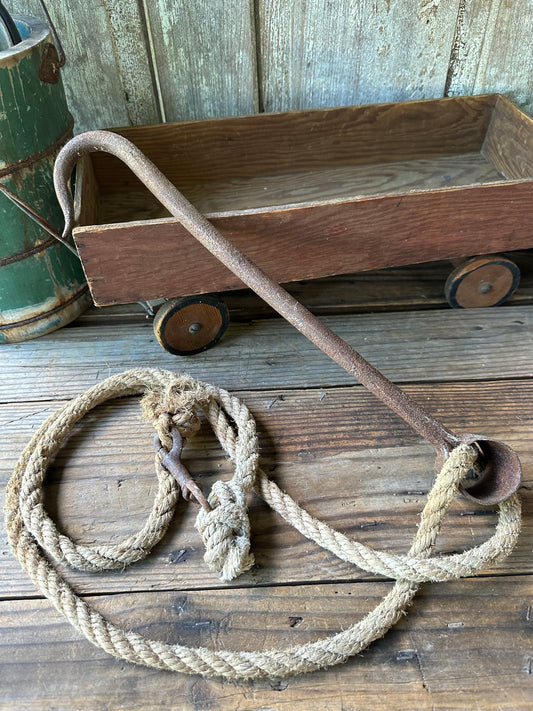 Rusty Metal Hook With Rope